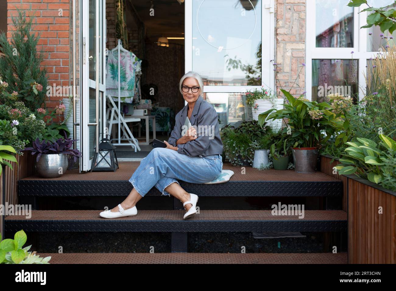 Old lady sitting on porch hi-res stock photography and images - Alamy