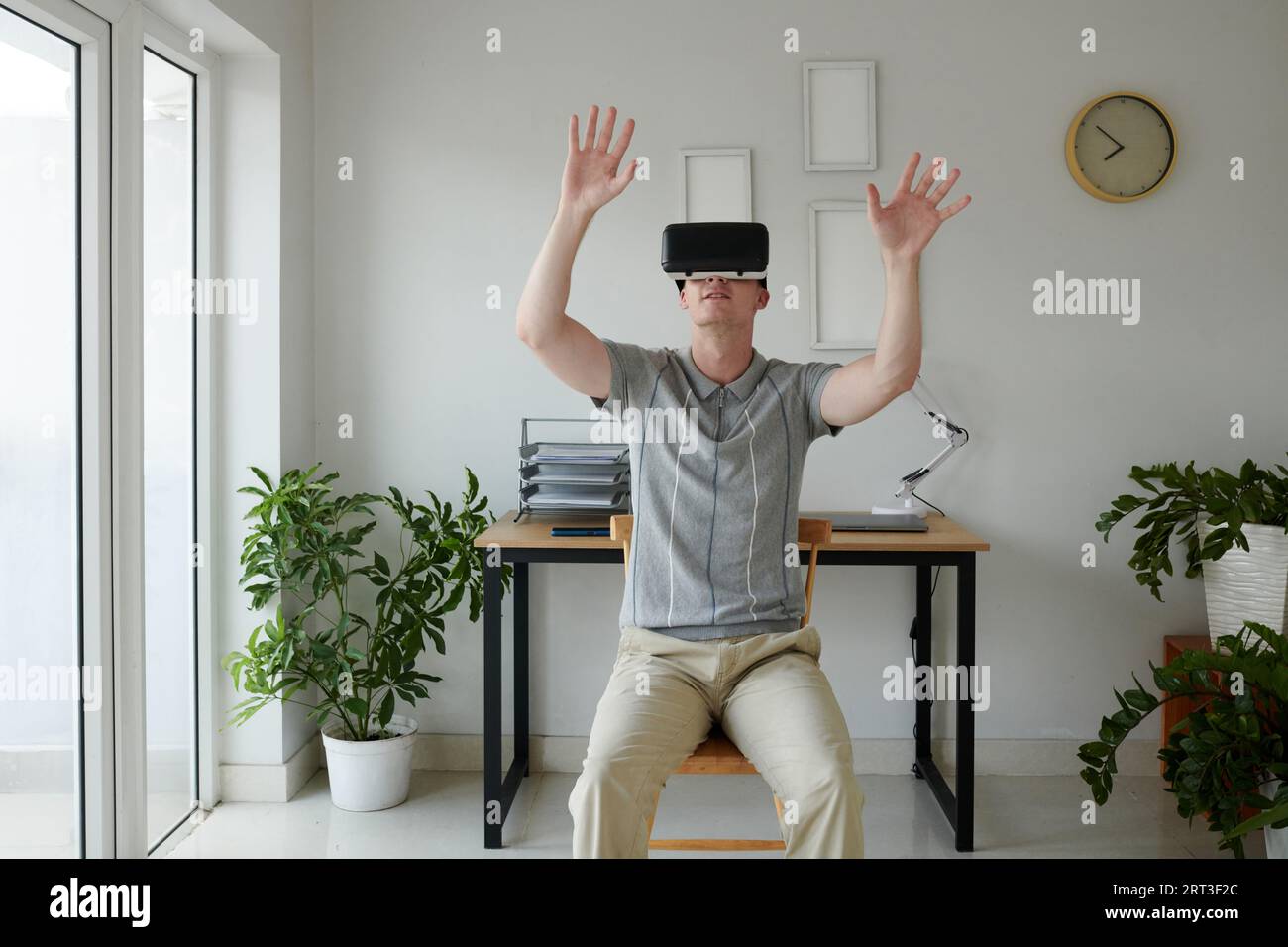 Software developer testing new virtual reality app he created Stock Photo