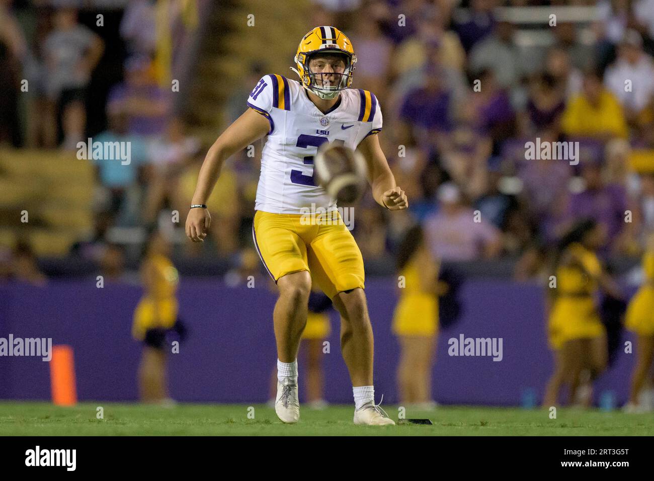 LSU place kicker Nathan Dibert (31) watches his squib kick during an