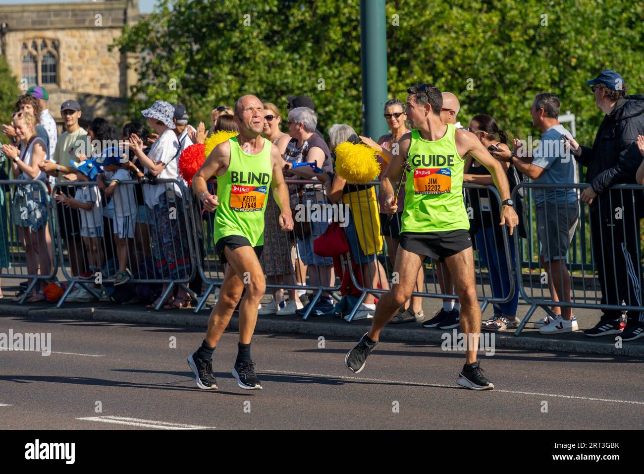 Great North Run 2023. A blind runner and guide crossing the Tyne Bridge in Gateshead, UK. Stock Photo