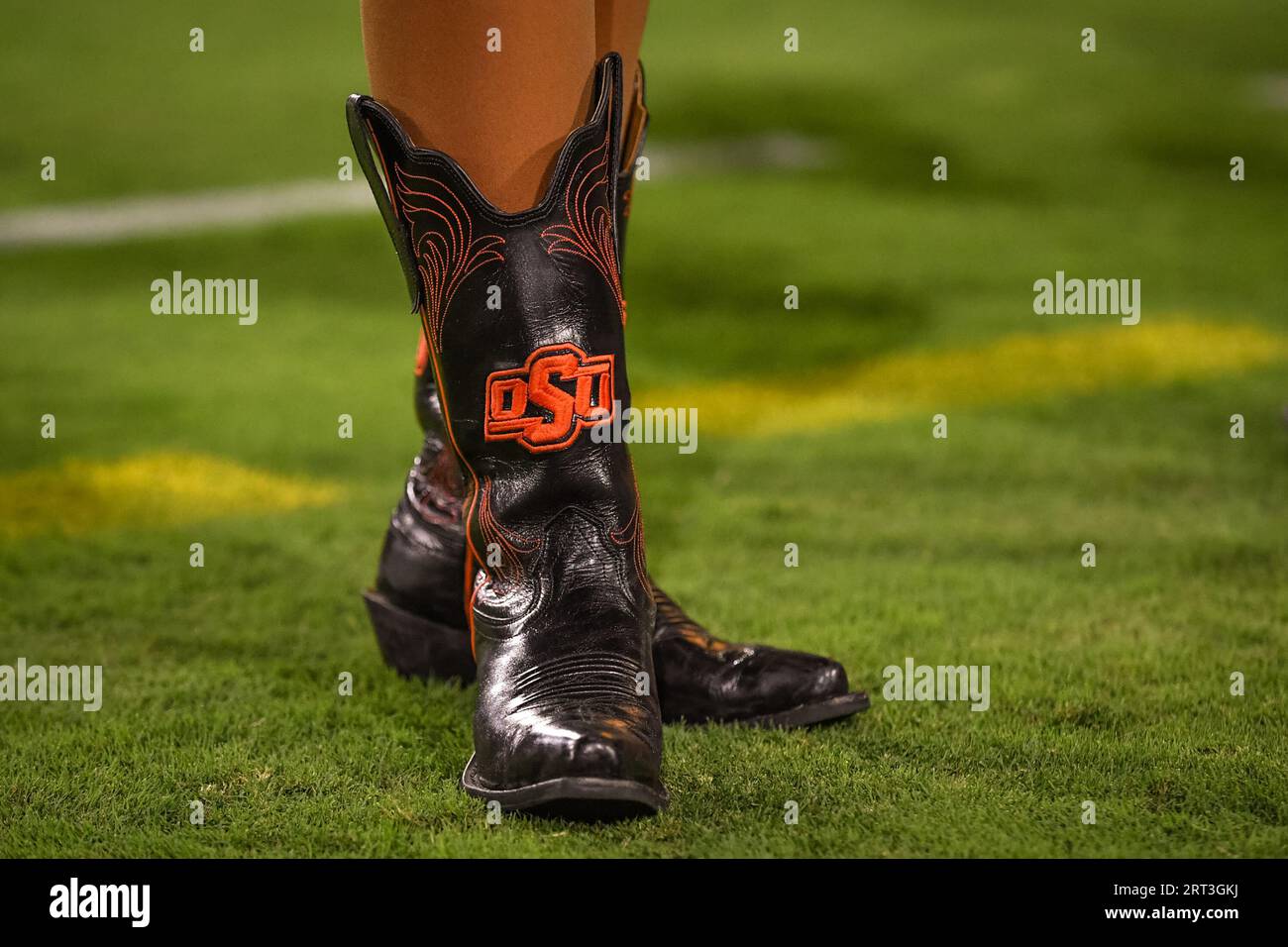 Oklahoma State cheerleader shows off her boots in the third quarter of a game against the Arizona State Sun Devils on Saturday, September 9, 2023. Okl Stock Photo