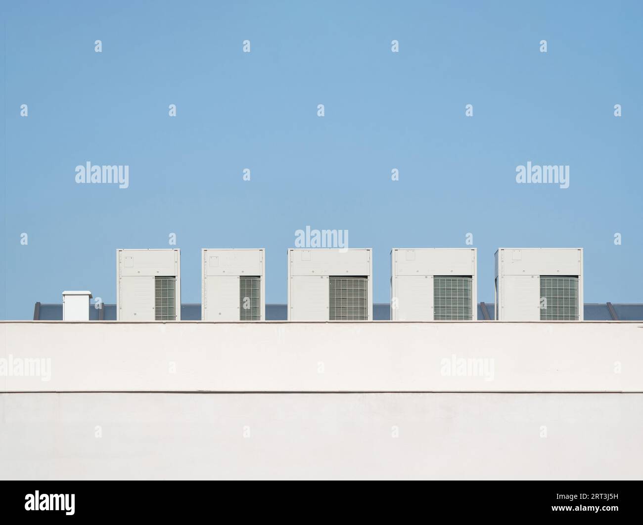 Cooling systems on building roofs. heating and cooling Stock Photo Alamy