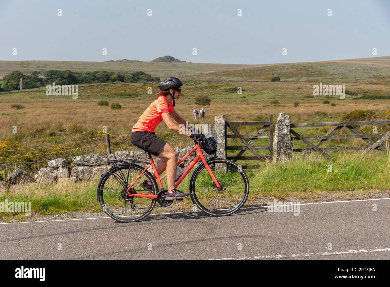 Dartmoor, Devon, England, UK. September 2023. Female cyclist on a bike ride close to Merrivale