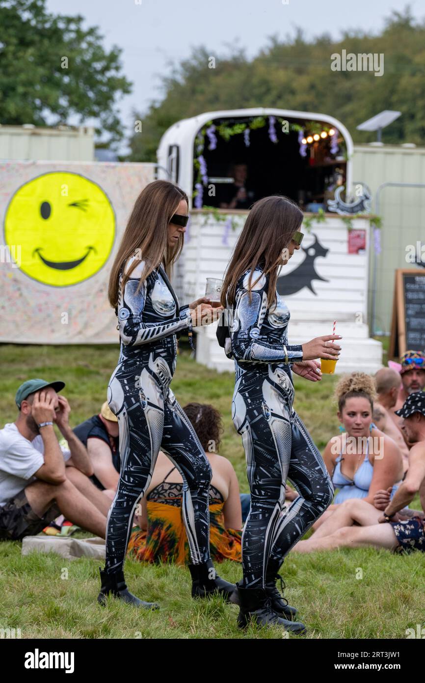 Cat suits and a cheeky wink. Music festival. Mucky Weekender Festival, Vicarage Farm, Woodmancott, near Winchester, Hampshire, UK Stock Photo