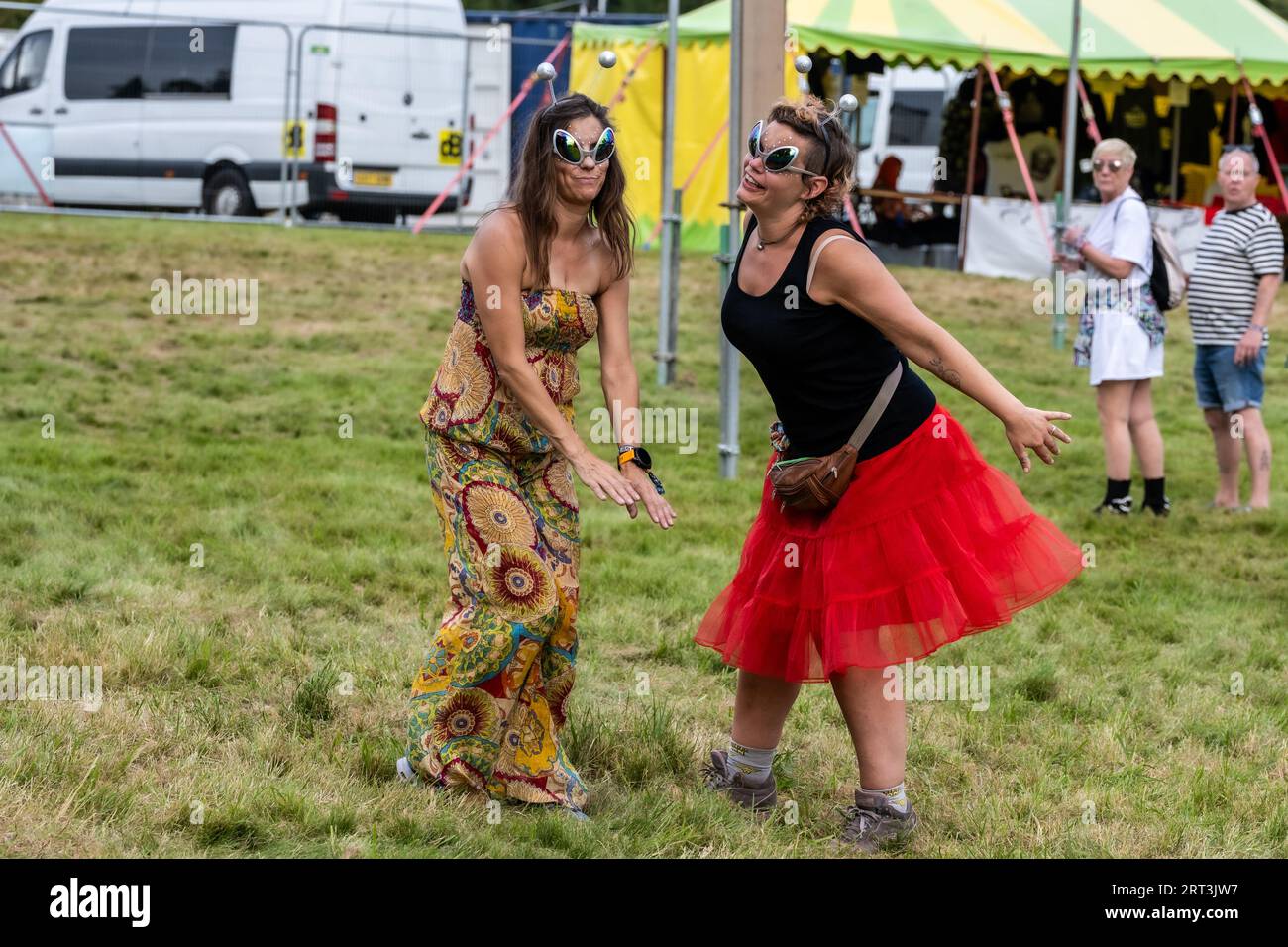Chilling out at a music festival. Mucky Weekender Festival, Vicarage Farm, Woodmancott, near Winchester, Hampshire, UK Stock Photo