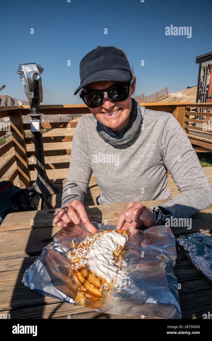 Woman Eating Waffle At The Top Of Jackson Hole Mountain Resort Stock Photo Alamy