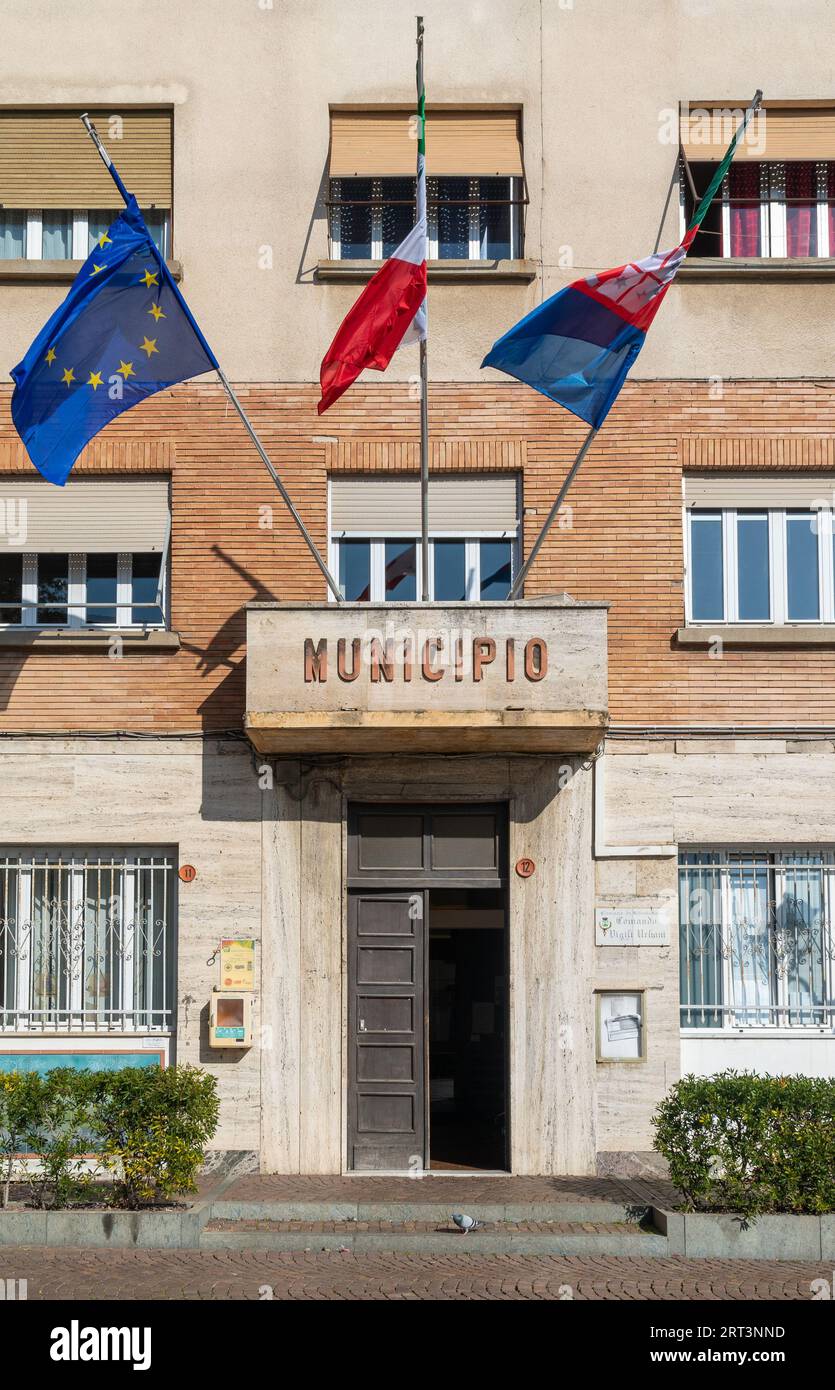 The facade with flags of the town hall hires stock photography and