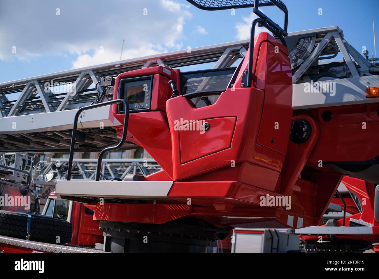 Retractable ladder on a fire truck with a control panel for