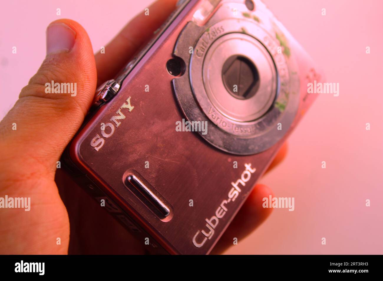 A photo of a small pink Sony Cyber Shot camera. Stock Photo