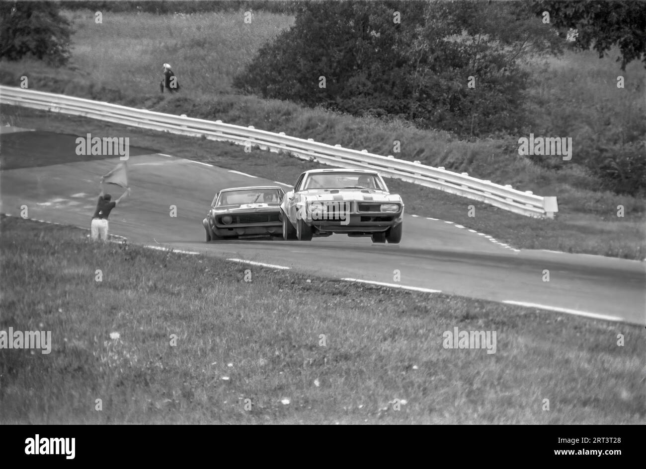 Cars coming uphill though turn 3 at the 1969 Trans Am at Watkins Glen