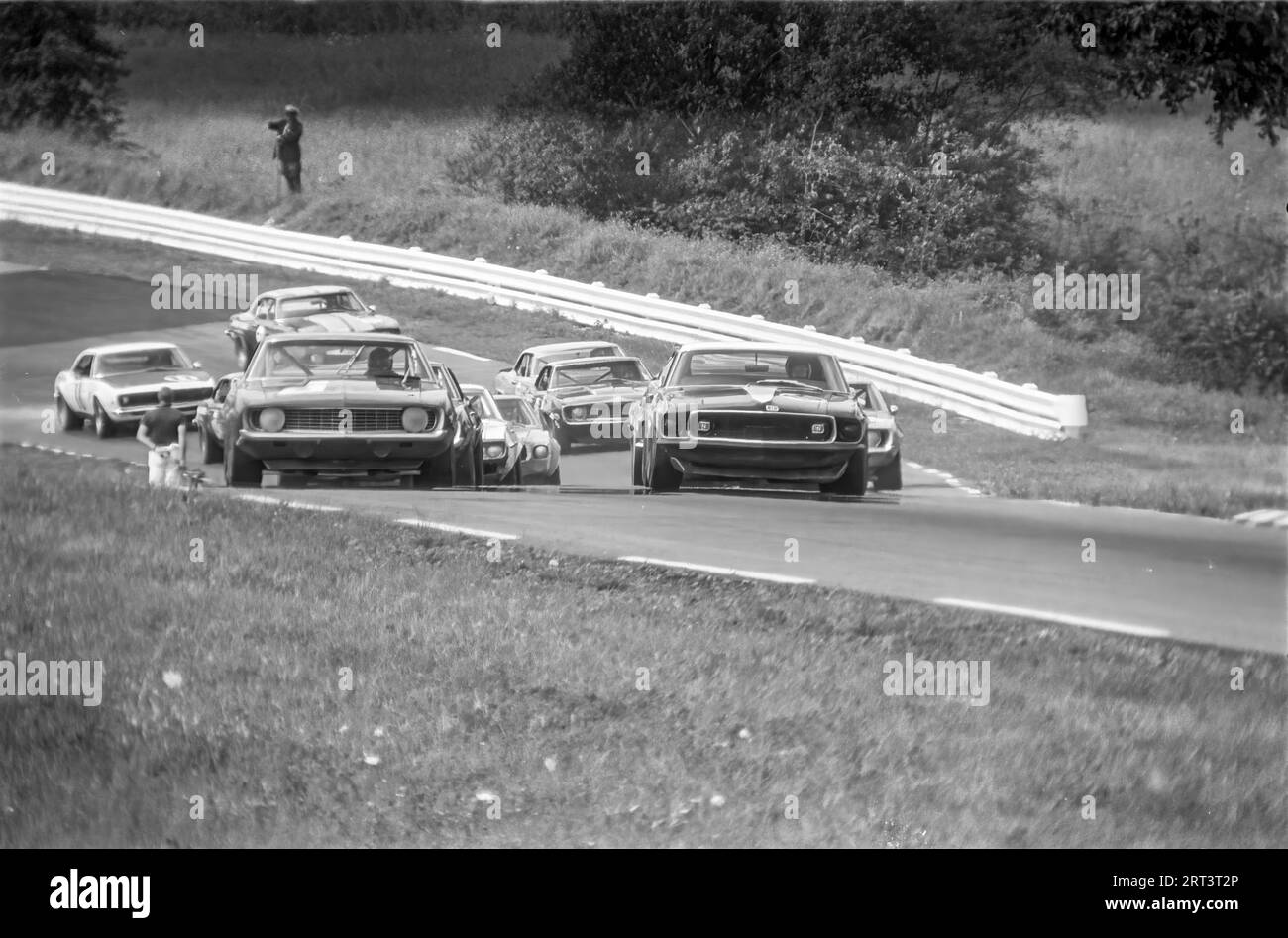 Cars coming uphill though turn 3 at the 1969 trans am at watkins glen