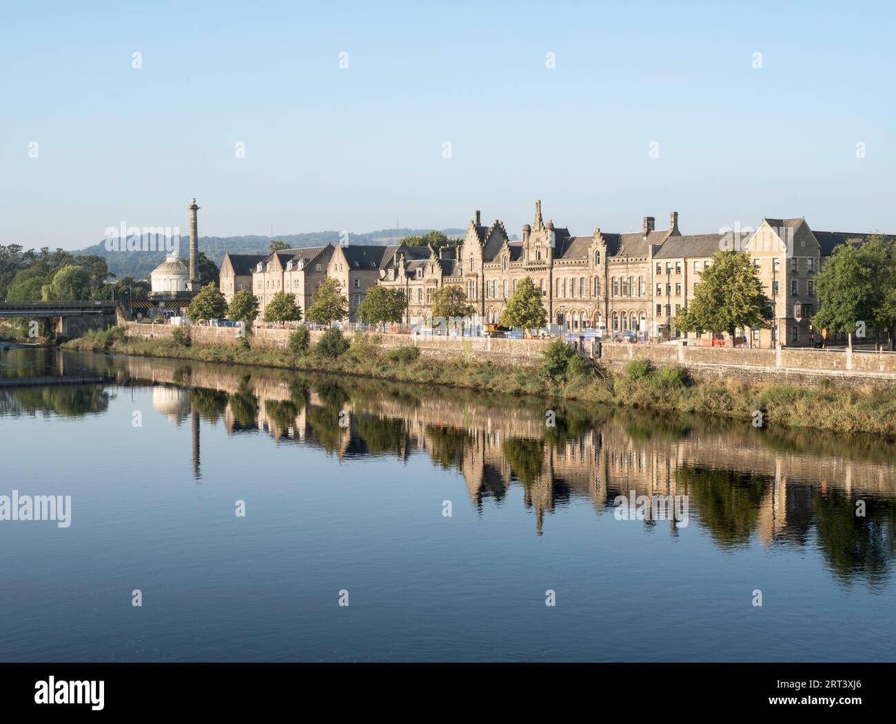 Buildings reflected in the river Tay in Perth, Scotland, UK Stock Photo