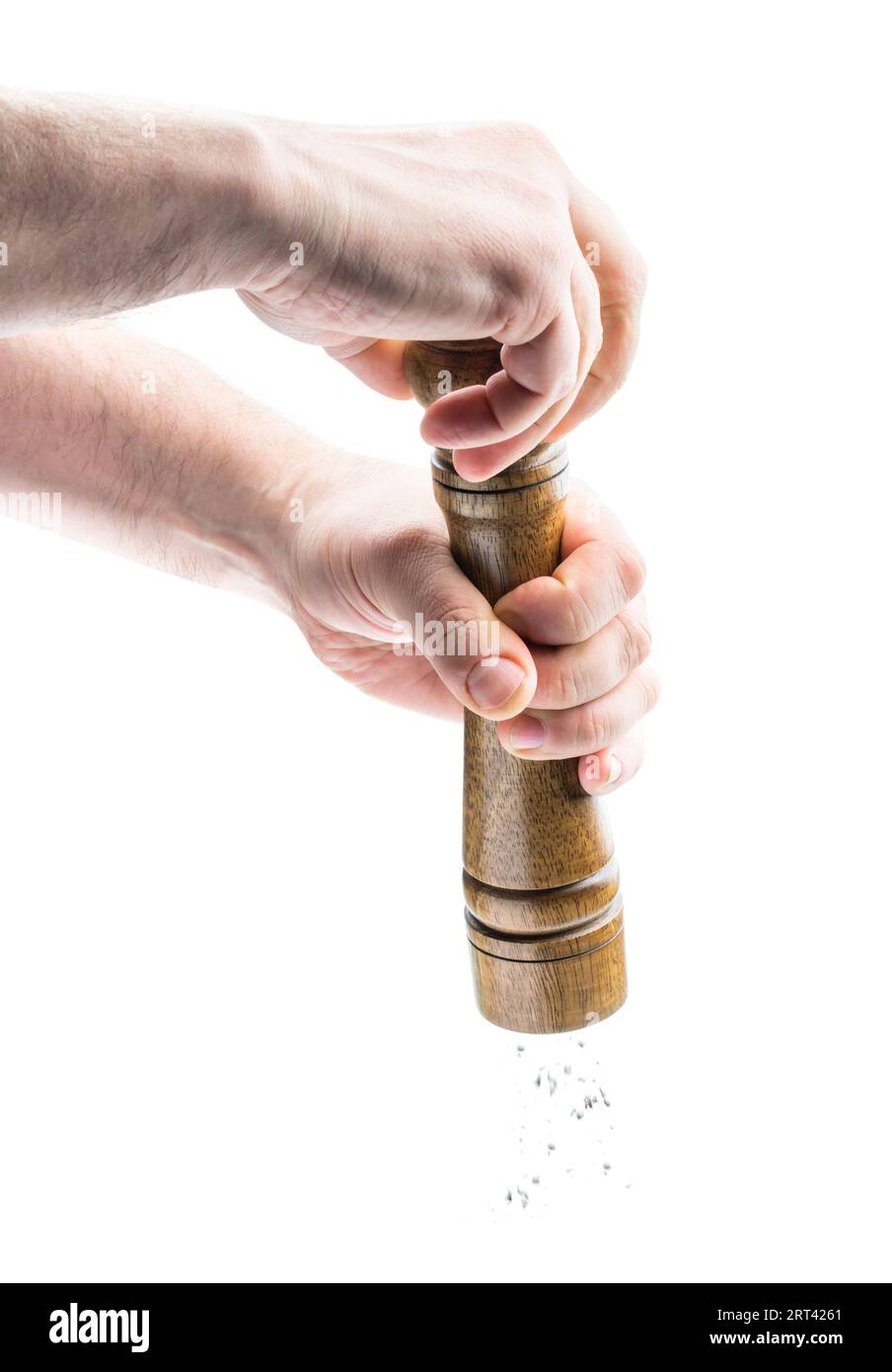 Hands  holding Pepper shaker isolated on white background Stock Photo