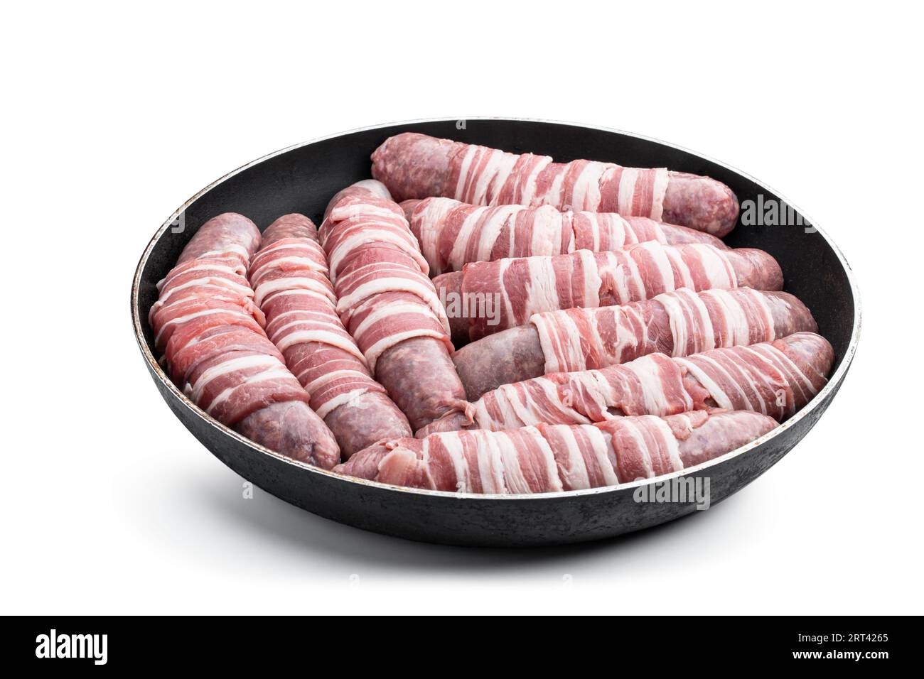Sausages  wrapped in bacon in frying pan isolated on white background Stock Photo