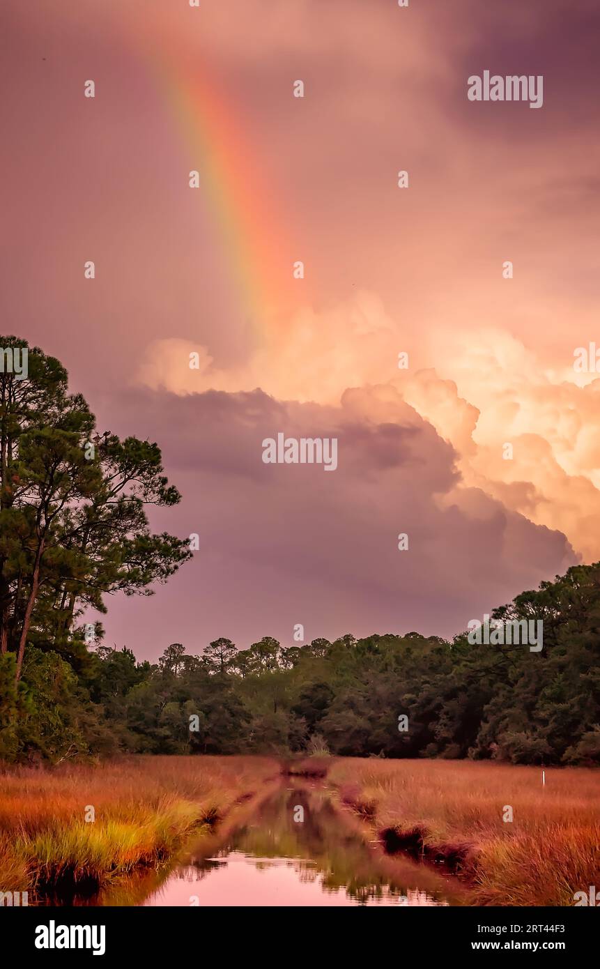 A rainbow appears at sunset after a storm, Sept. 2, 2023, in Bayou La