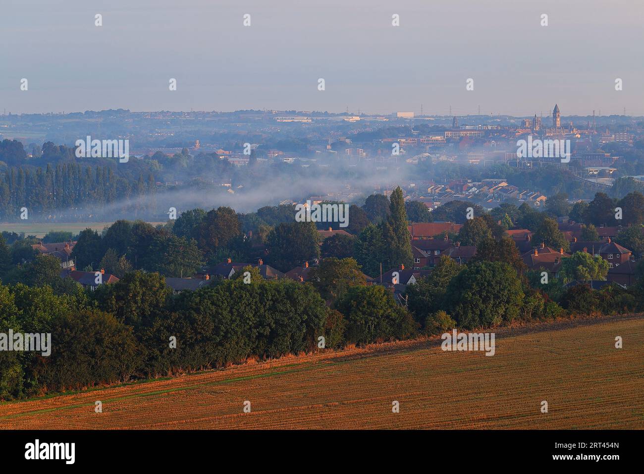 A view of Wakefield City on a misty morning, as seen from nearby Sandal Castle. Stock Photo