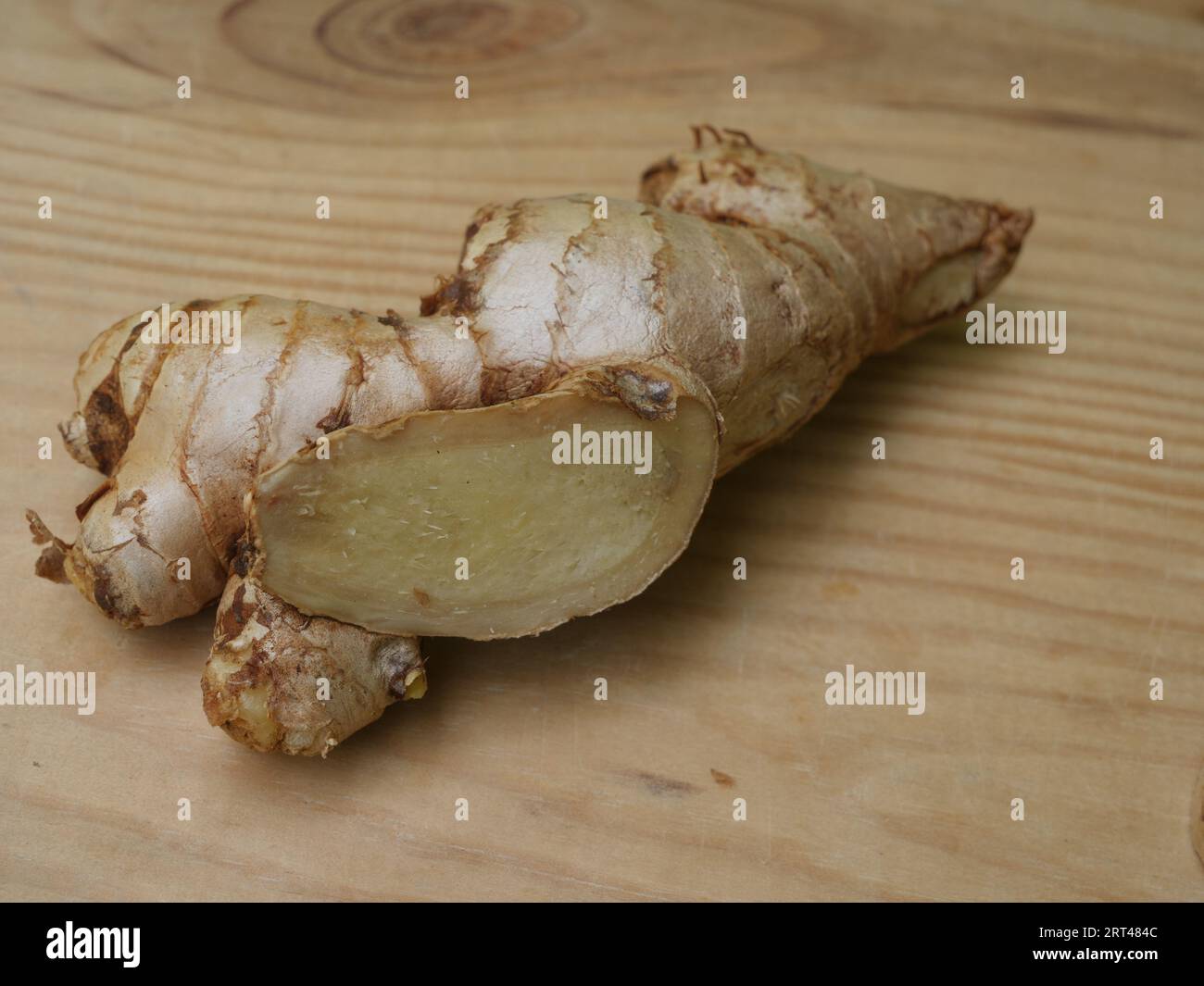 Ginger root with sliced portions Stock Photo