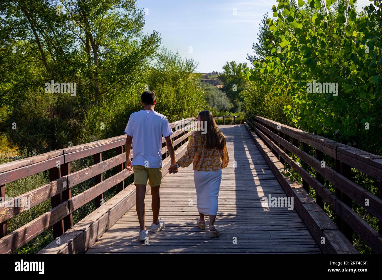 Girl and boy holding hands hi-res stock photography and images - Alamy