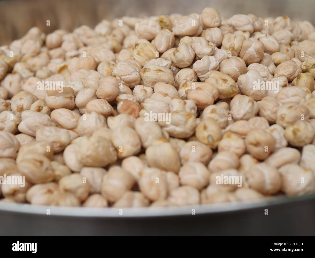 raw chickpea on plate , side angle view Stock Photo