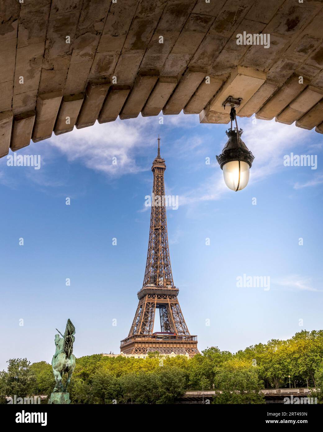 Paris, France - May 27, 2023: Eiffel tower seen from arch of Bir Hakeim bridge in Paris Stock Photo