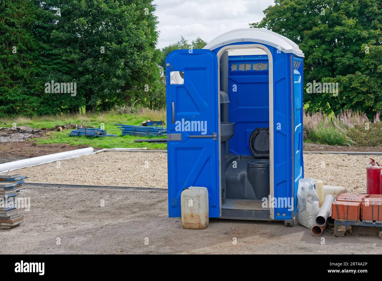 Toilet outdoors at construction site for workers Stock Photo