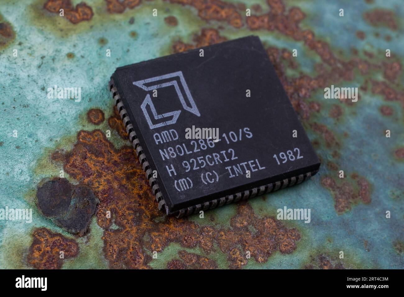 KYIV, UKRAINE - August 2, 2023. AMD 286 processor unit on rusty background. Stock Photo