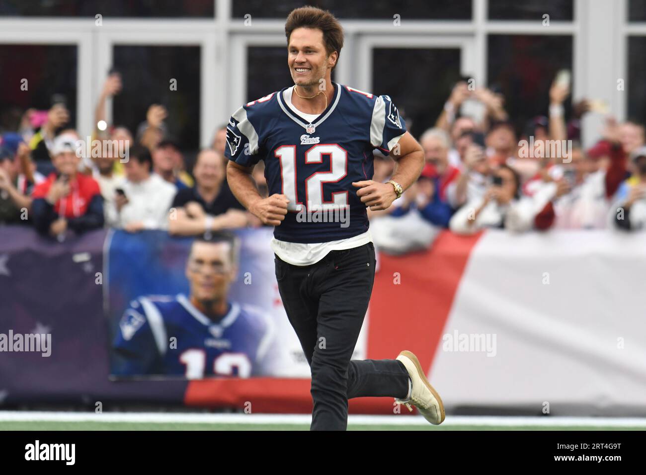 Former New England Patriots quarterback Tom Brady runs on the field
