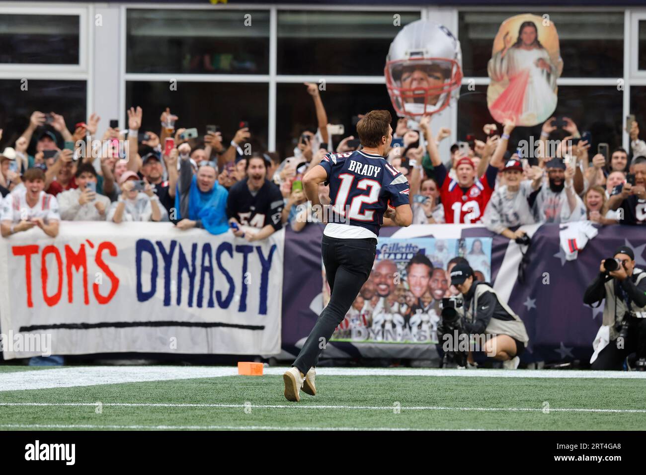 New England Patriots quarterback Tom Brady (12) stands during pre game  warmups before the game against