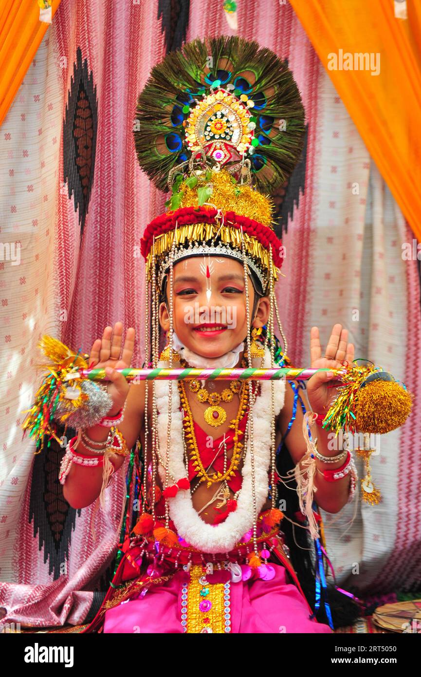 Young Children dress up as Radha and Krishna during the colorful rally ...