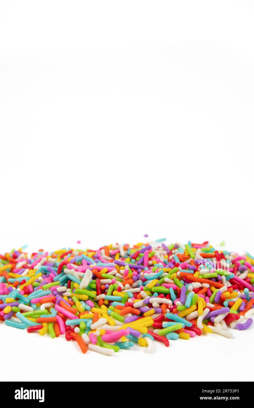 colorful sugar sprinkles on white background Stock Photo Alamy
