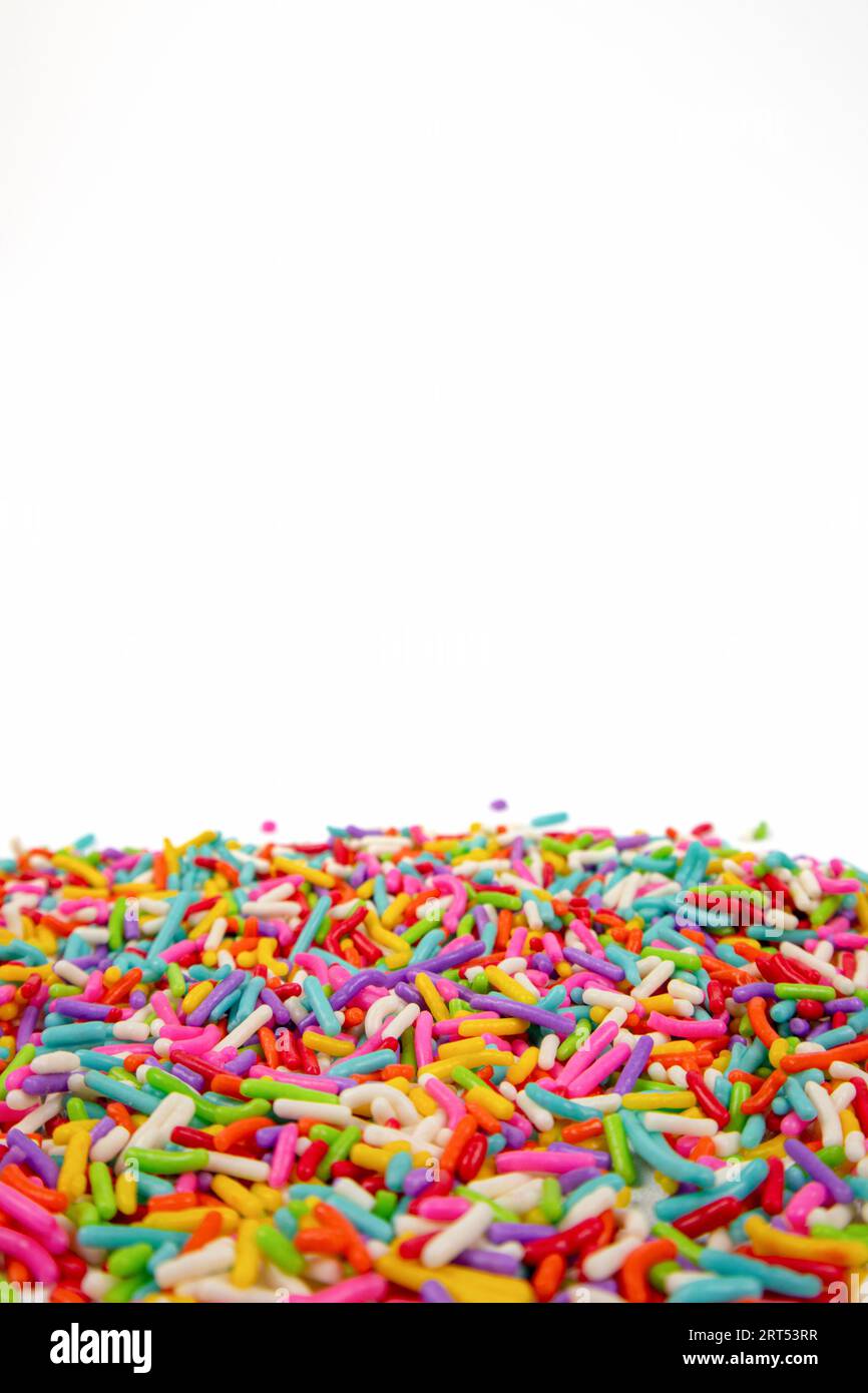 colorful sugar sprinkles on white background Stock Photo Alamy