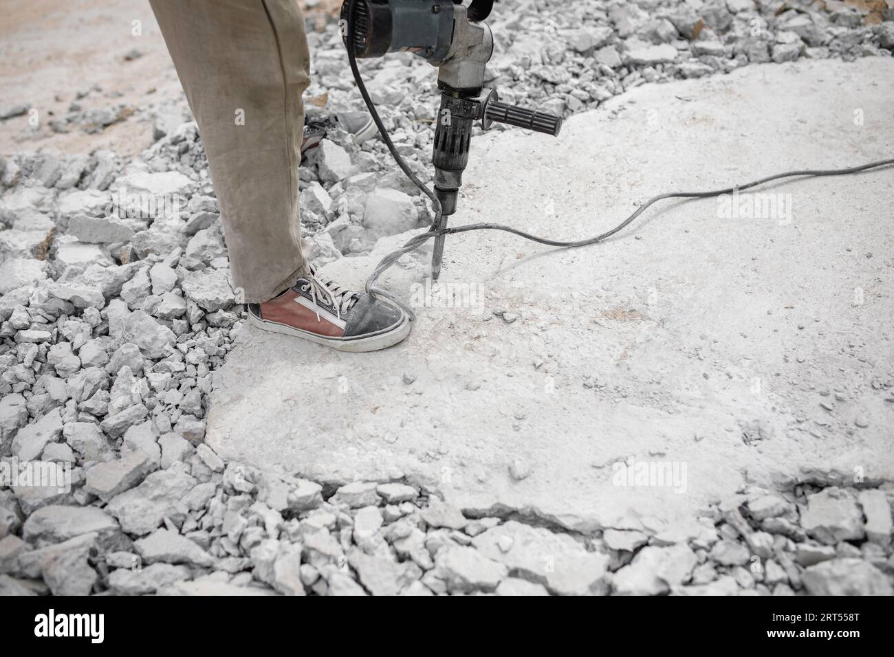 Worker use Electric Concrete Breaker. Worker destroy surface with