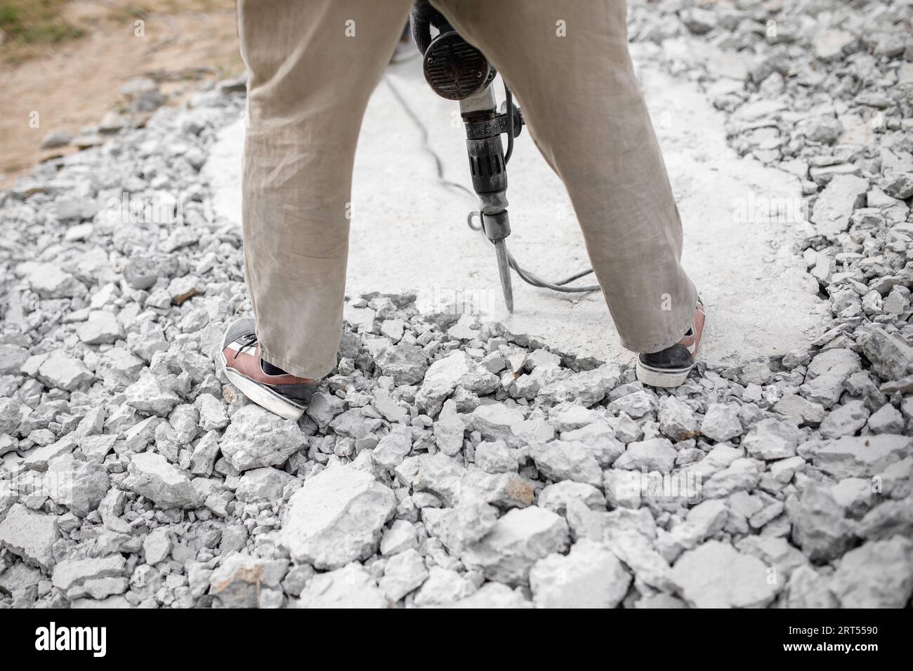 Worker use Electric Concrete Breaker. Worker destroy surface with