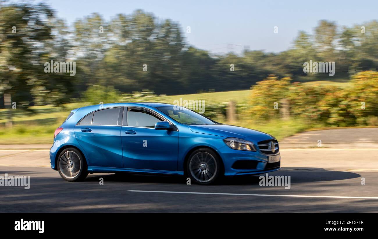 Milton Keynes,UK - Sept 4th 2023: 2013 blue Mercedes Benz A class car travelling on an English road Stock Photo