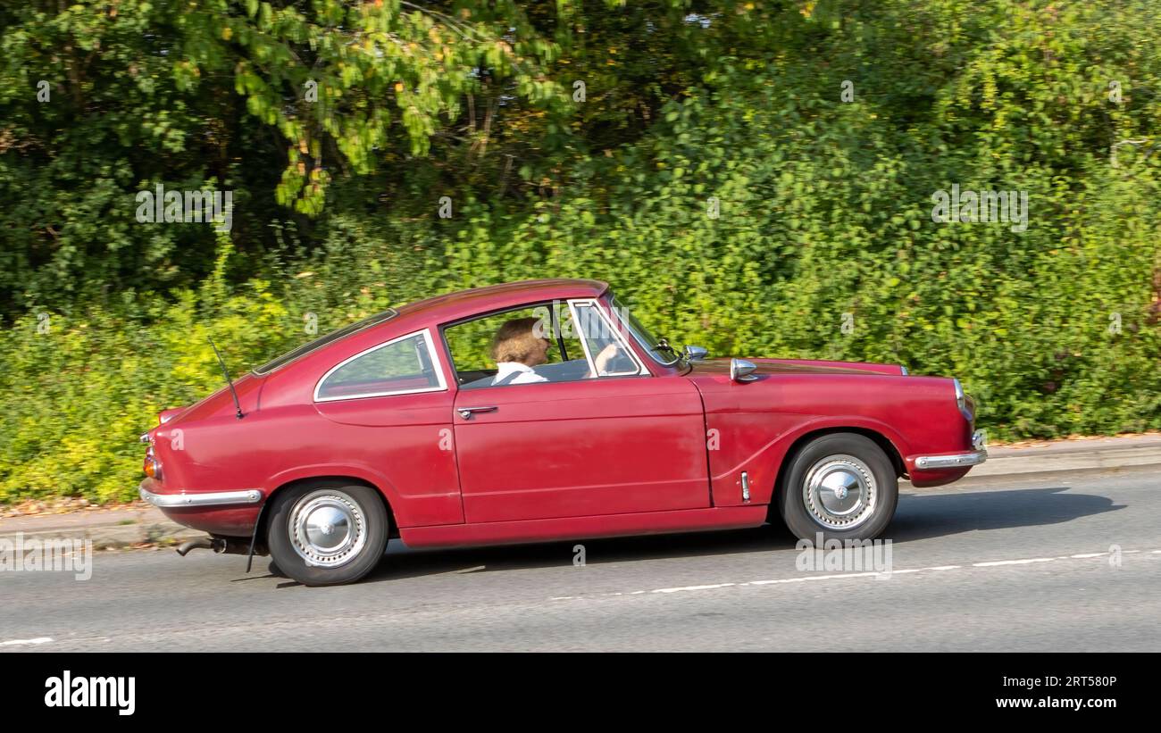 Milton Keynes,UK-Sept 10th 2023: 1964 red Bond Equipe car travelling on an English road. Stock Photo