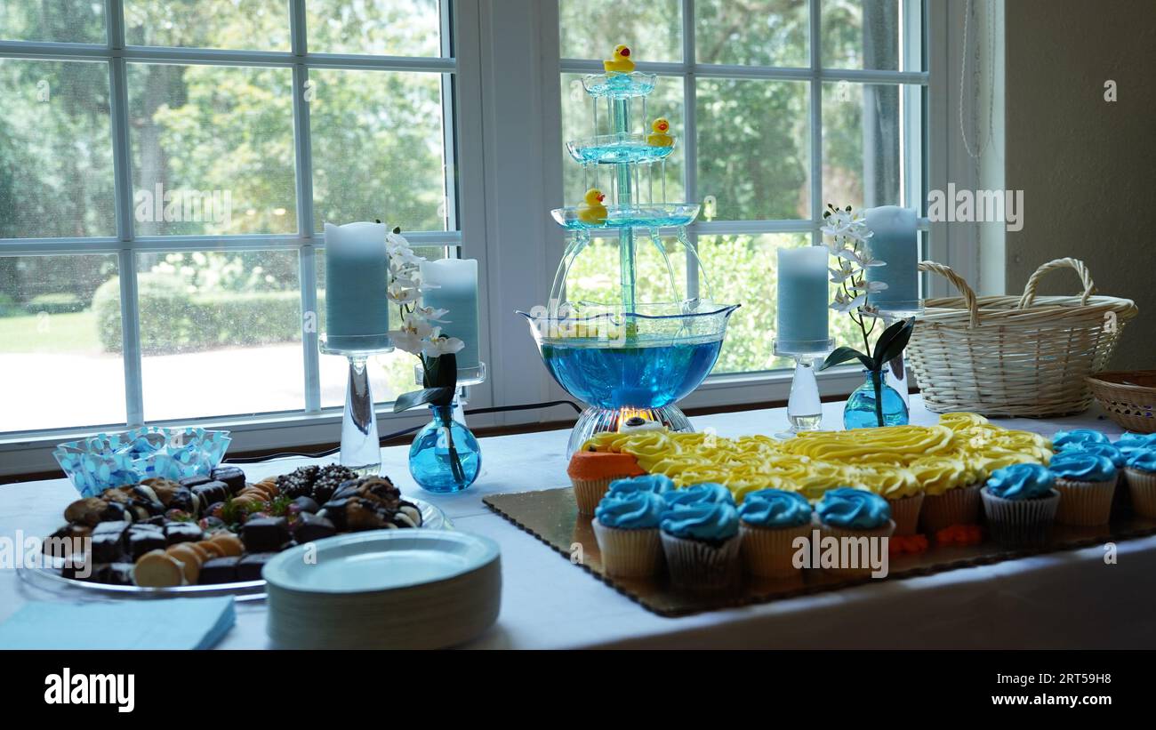 A closeup of blue and yellow cupcakes for duck-themed baby shower Stock  Photo - Alamy, image size:1300x821