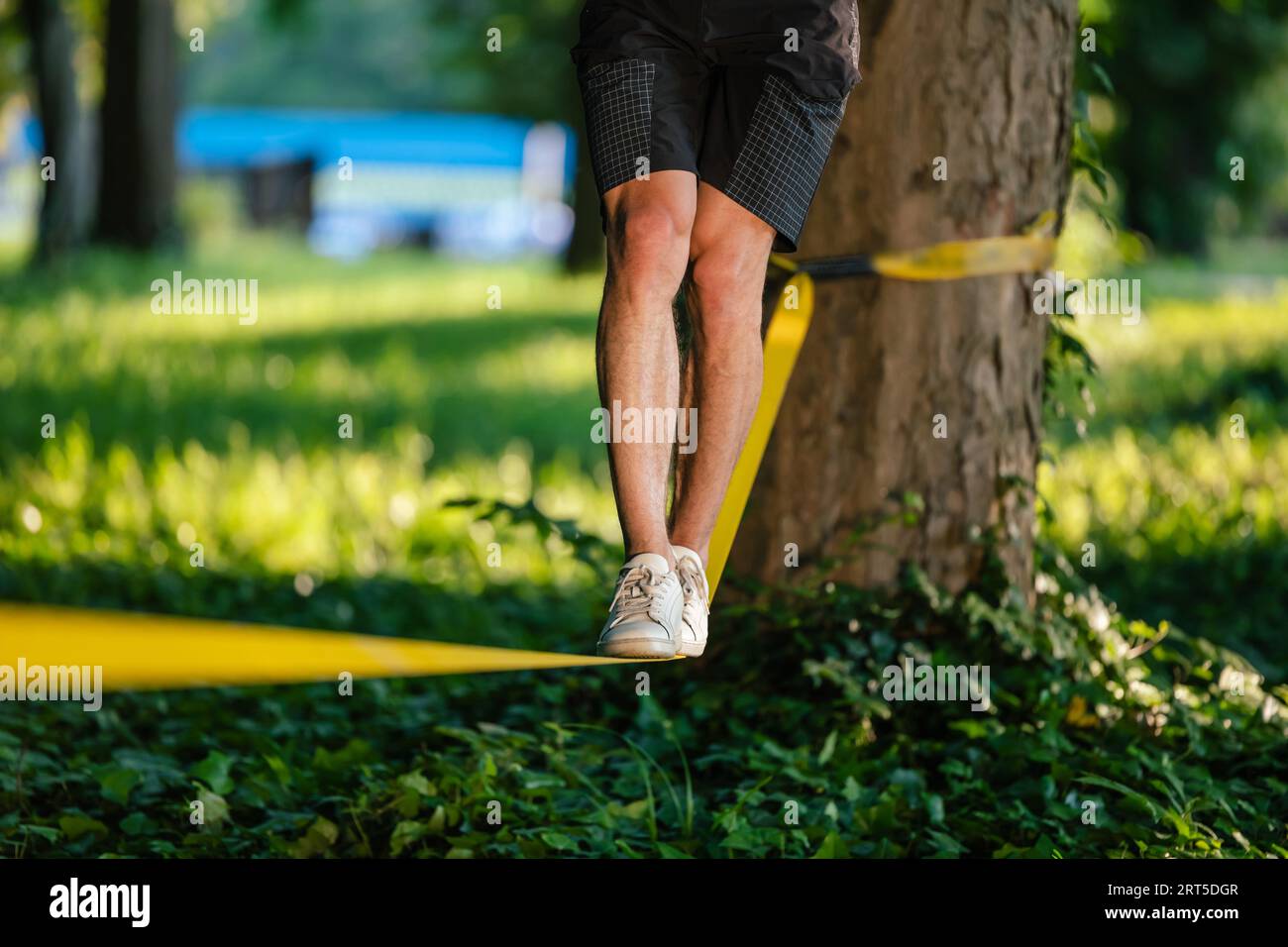 Close up picture of mans legs walking on the rope Stock Photo - Alamy