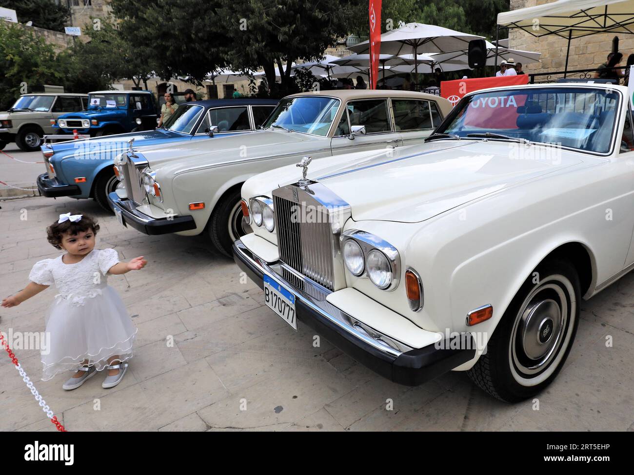 Deir El Qamar, Lebanon. 10th Sep, 2023. A girl is seen during a classic car show held in Deir el Qamar, Mount Lebanon Governorate, Lebanon, on Sept. 10, 2023. A classic car show was held Sunday in Deir el Qamar, a historic town in south-central Lebanon, featuring about 50 classic cars from different eras. Credit: Liu Zongya/Xinhua/Alamy Live News Stock Photo