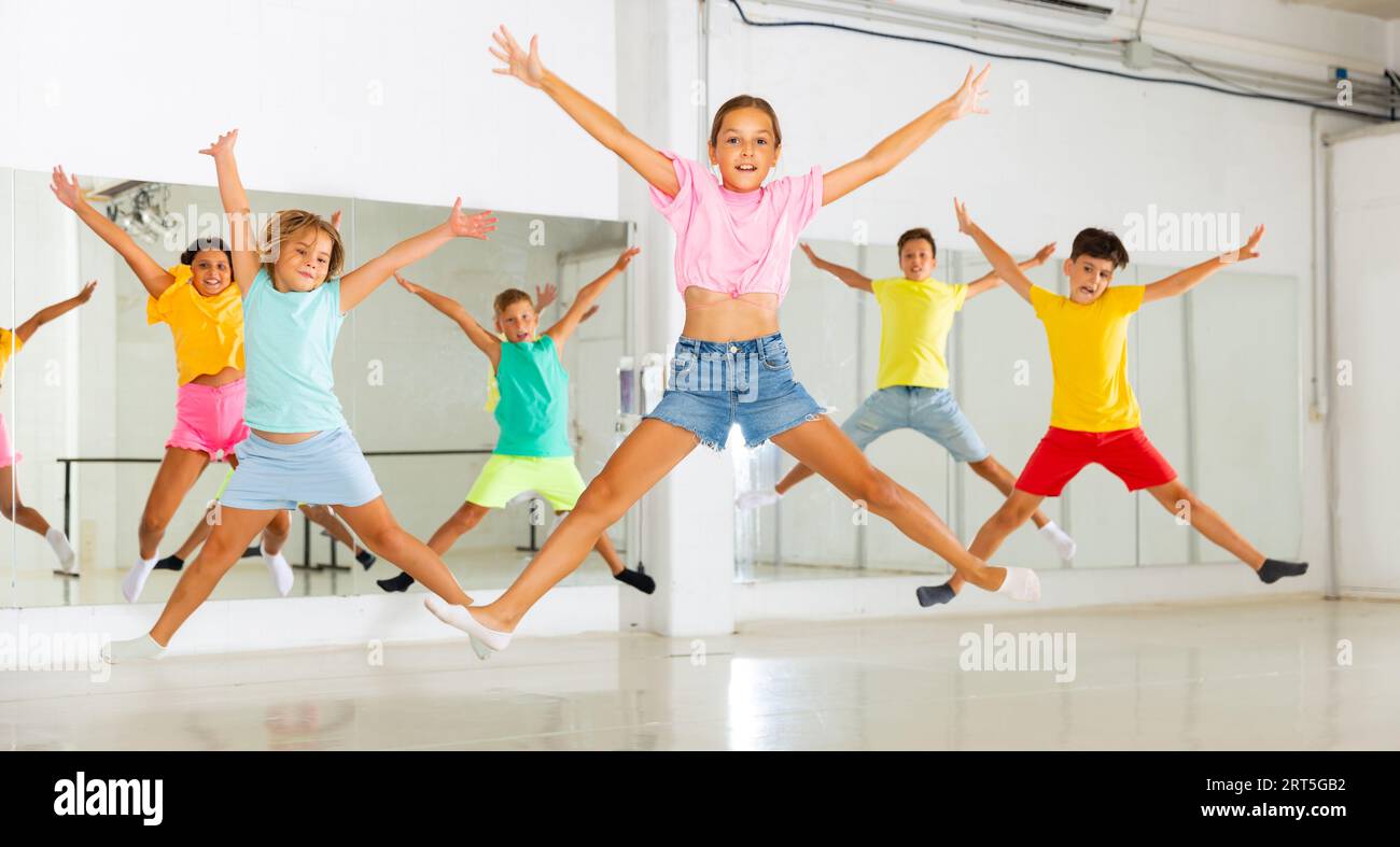 Kids jumping in dance studio Stock Photo - Alamy