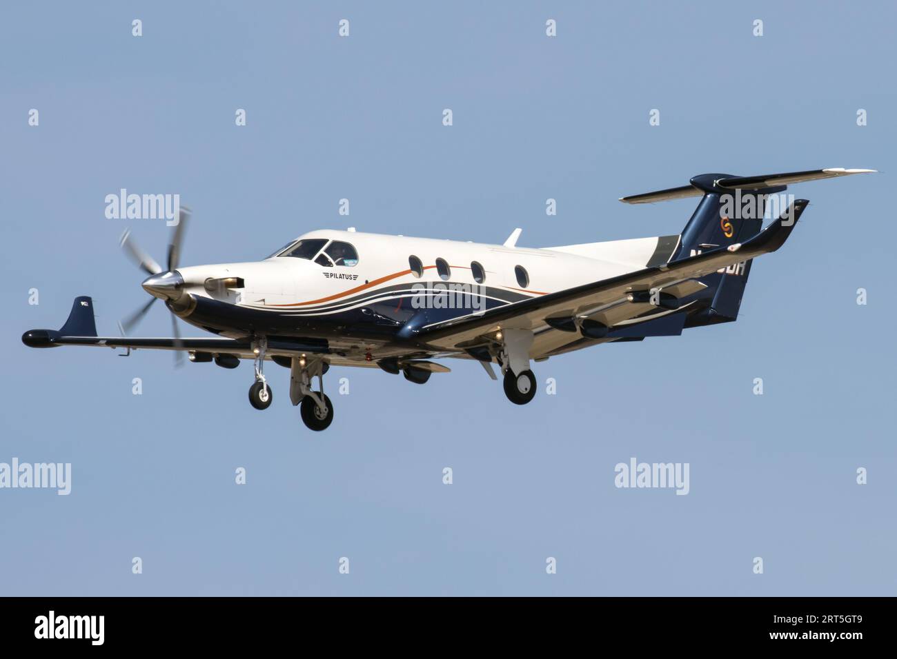 A Pilatus PC-12/45 turboprop plane landing at Phoenix Sky Harbor Airport. Stock Photo