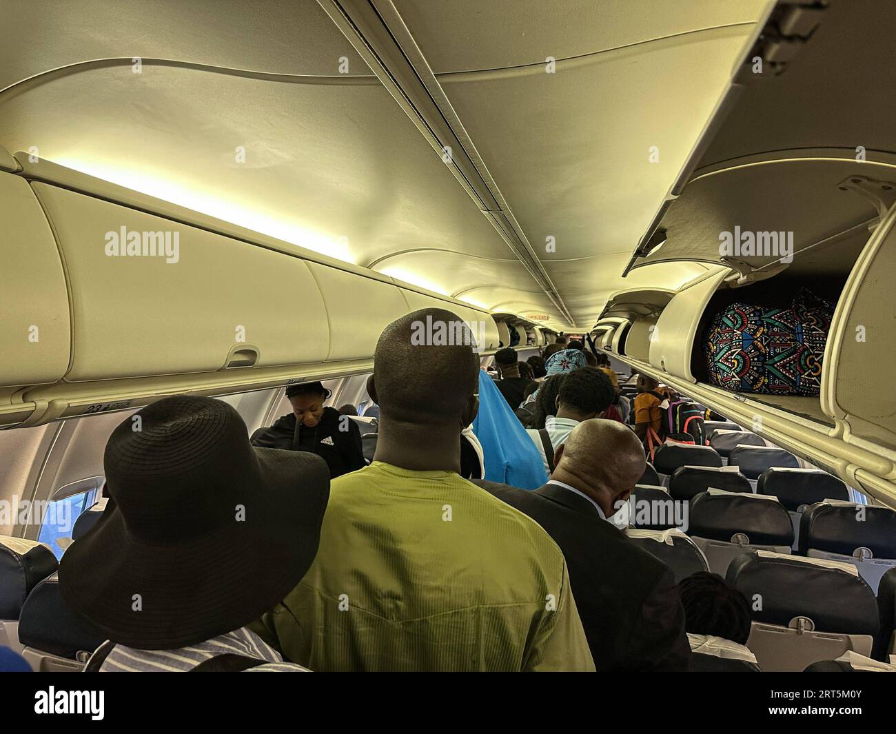 230906 -- LIBREVILLE, Sept. 6, 2023 -- Passengers prepare to