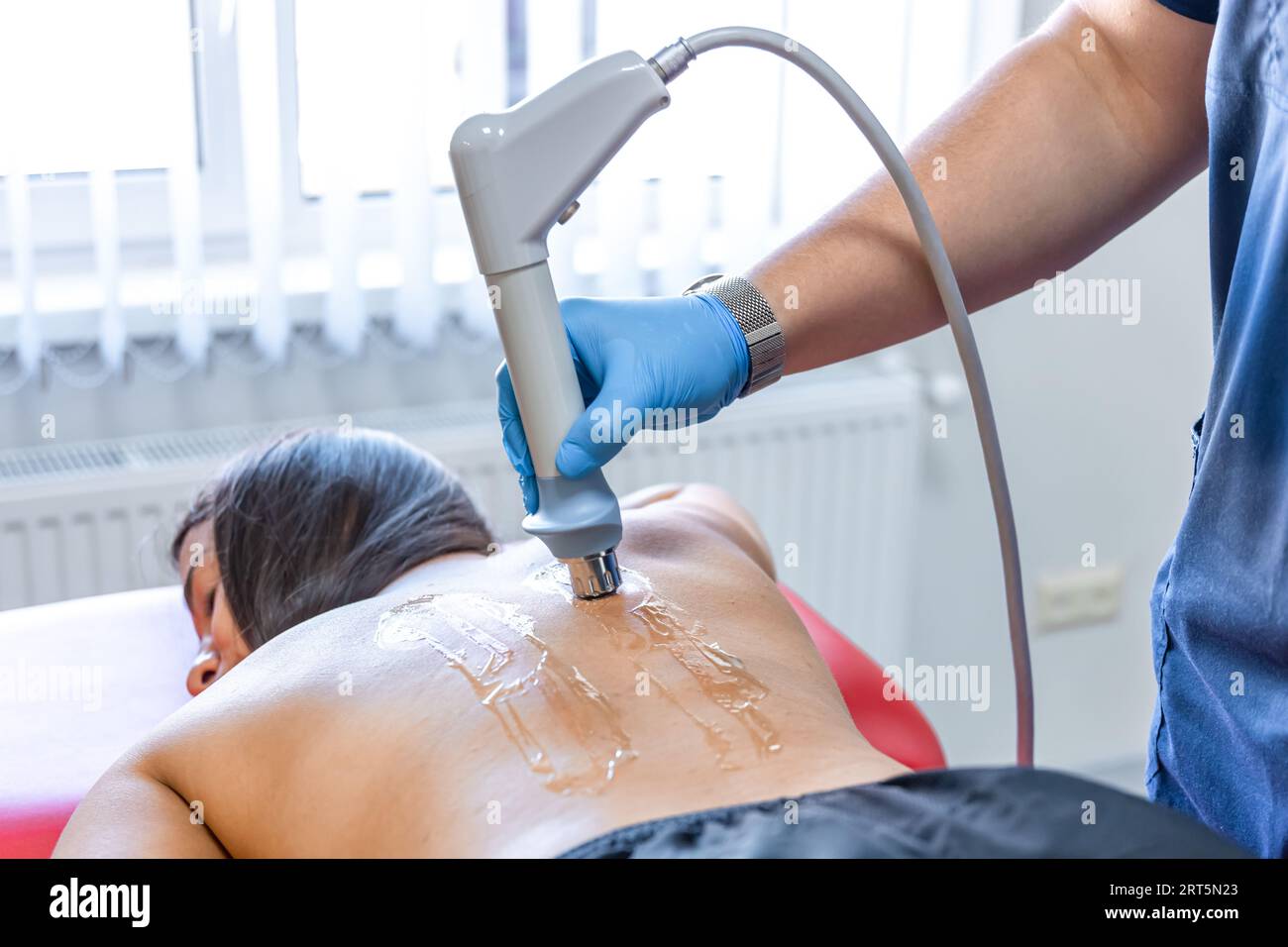 Extracorporeal Shockwave Therapy ESWT.Non-surgical treatment.Physical  therapy for neck and back muscles,spine with shock waves.Pain relief Stock  Photo - Alamy