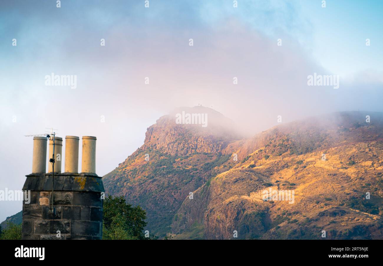 Edinburgh, Scotland, UK - Arthur's Seat in low cloud, man on summit Stock Photo