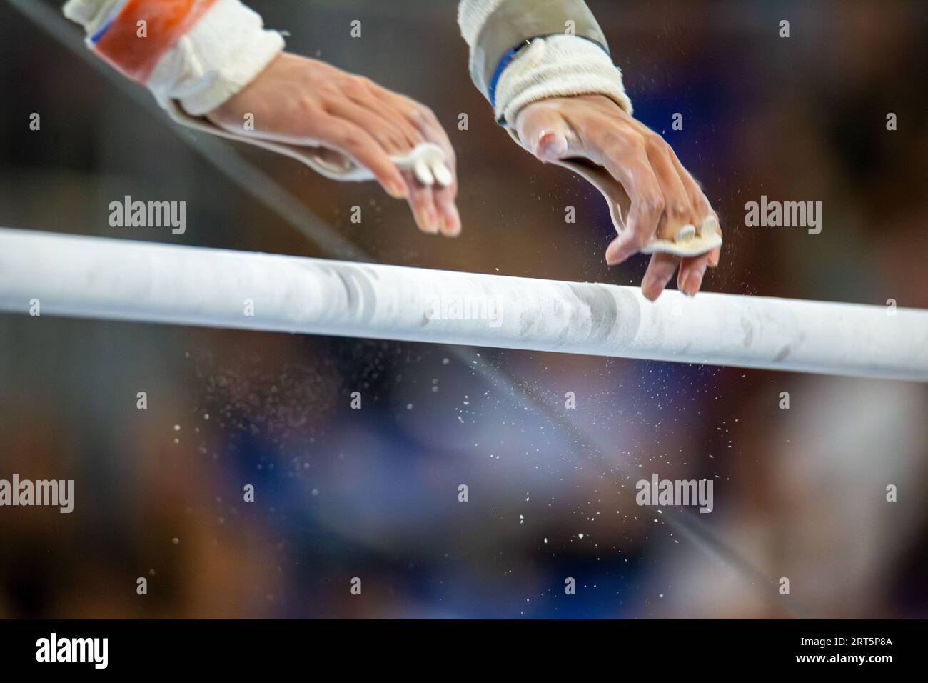 Symbol image of apparatus gymnastics: close-up of a gymnast on the uneven bars Stock Photo