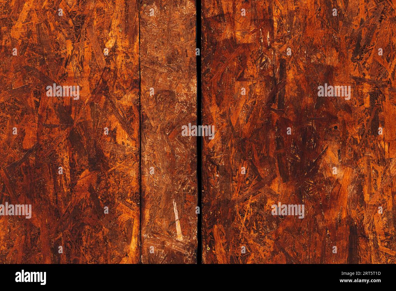 Oriented strand board (OSB) surface as background, brown painted wood Stock Photo
