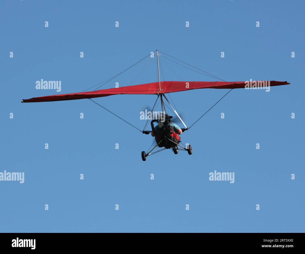A Cyclone Airsports Chaser S 503 microlight departs an airfield in East Sussex Stock Photo