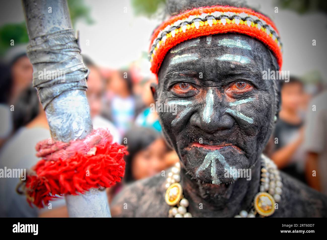 Man holding a spear at Ati Atihan festival. Stock Photo