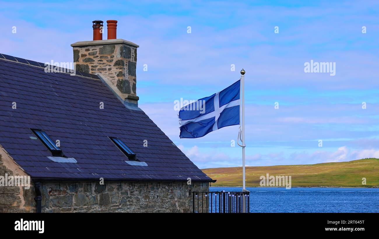 Shetland Flag waving on a typical medieval house in Lerwick downtown and port in Scotland, England. Stock Photo
