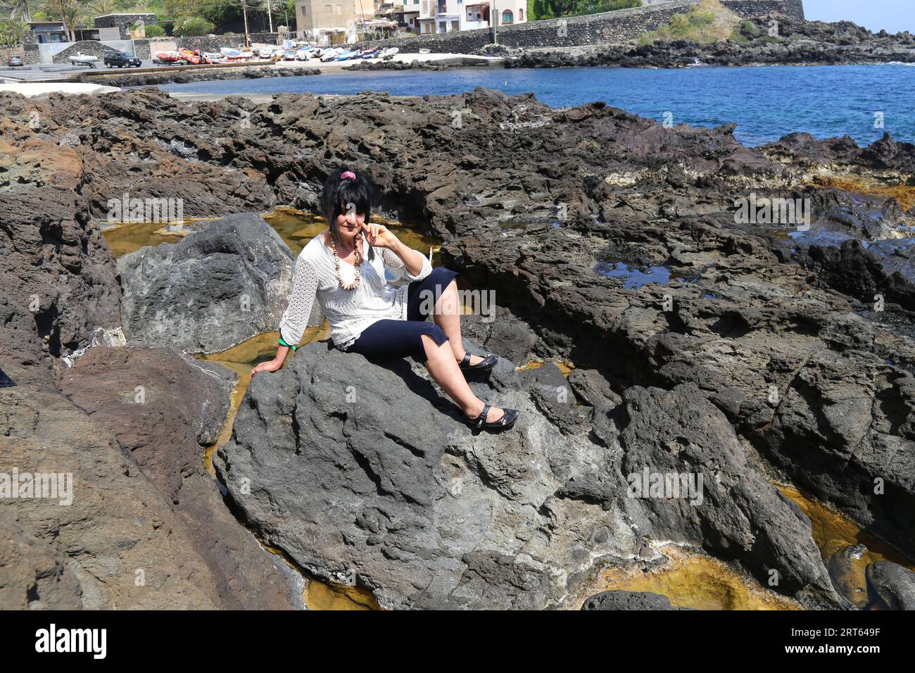 old woman in bikini on the rocks Stock Photo Alamy