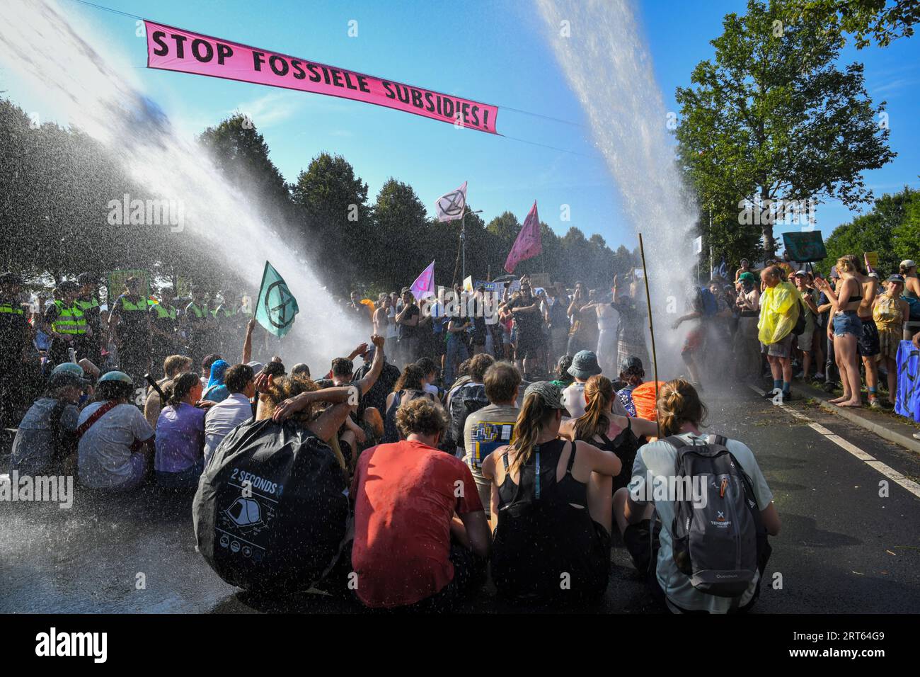 The Hague,The Netherlands, 9th september,2023. For the 8th time thousands of Extinction rebellion activists protested against fossil fuels subsidies by blocking the A12 motorway. Watercannons were used and police removed and arrested hundreds of people. Stock Photo